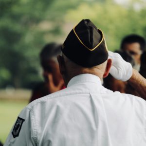 A saluting veteran represents EveryMind's military and veteran services.