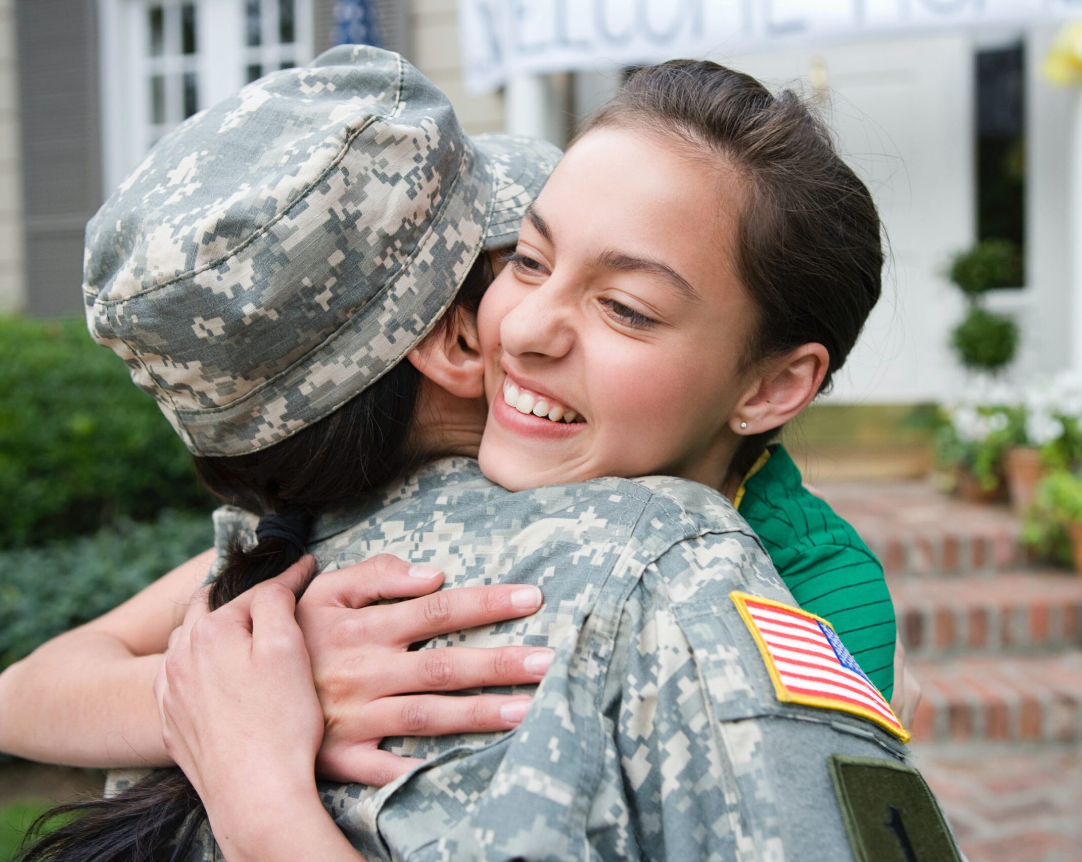 ServingTogether: a military service member hugs family